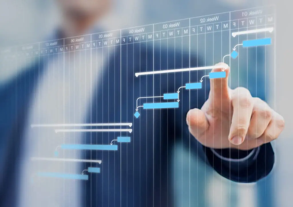 business man pointing at chart data