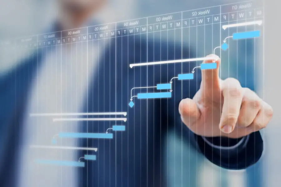 business man pointing at chart data