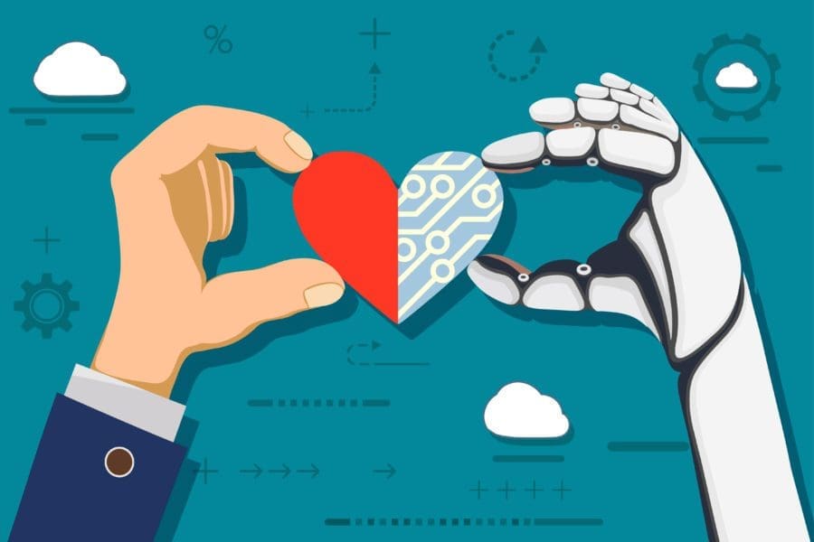 human hand and robot hand holding a heart