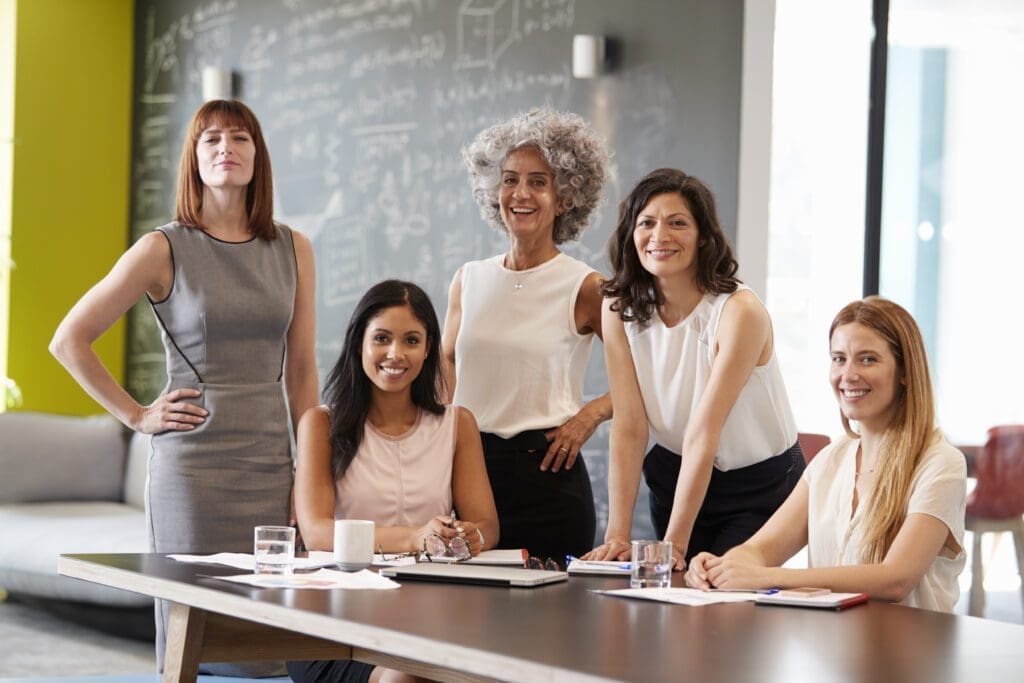 female business women smiling at camera