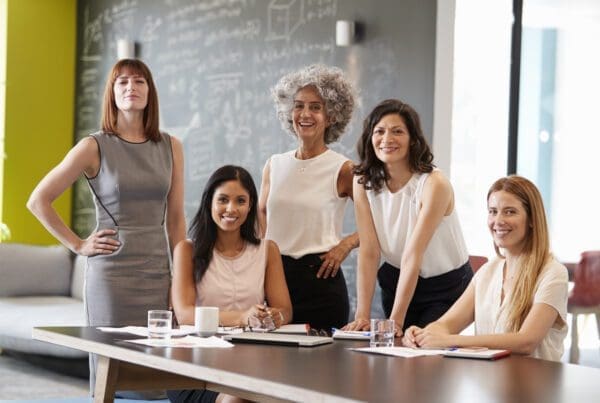 female business women smiling at camera